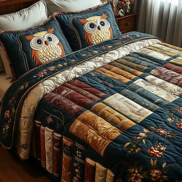 Night Reader quilted 3-piece bedding set on a made bed with two matching pillow shams