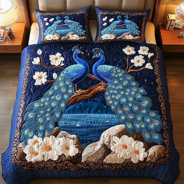 Night Serenade quilted 3-piece bedding set on a made bed with two matching pillow shams
