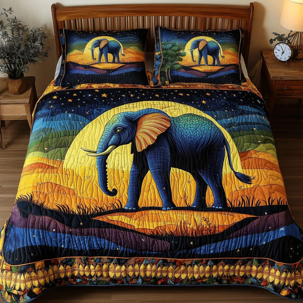 Night Sky Elephant quilted 3-piece bedding set on a made bed with two matching pillow shams