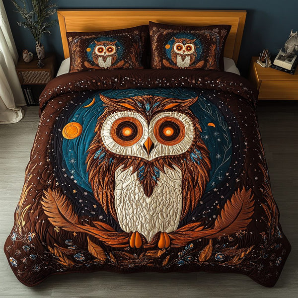 Nightfall Feathers quilted 3-piece bedding set on a made bed with two matching pillow shams