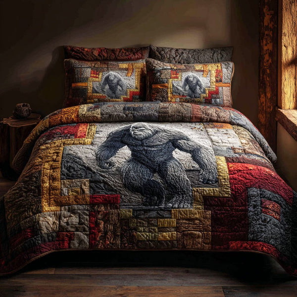 Nightwalker quilted 3-piece bedding set on a made bed with two matching pillow shams
