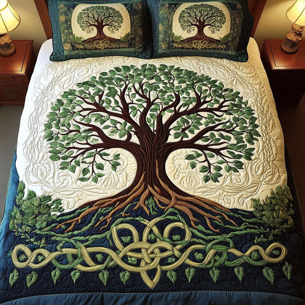 Oak of Wisdom quilted 3-piece bedding set on a made bed with two matching pillow shams
