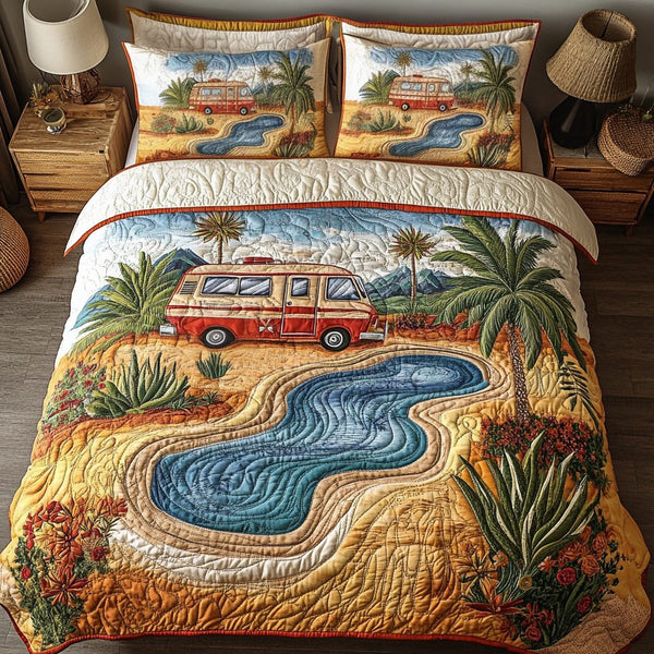 Oasis Escape quilted 3-piece bedding set on a made bed with two matching pillow shams