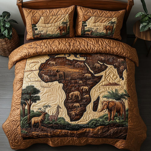 Oasis Night quilted 3-piece bedding set on a made bed with two matching pillow shams