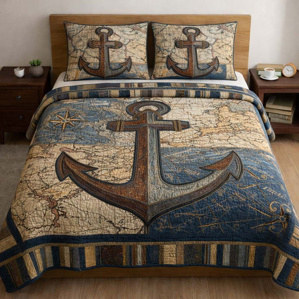 Ocean Anchor quilted 3-piece bedding set on a made bed in a light coastal bedroom