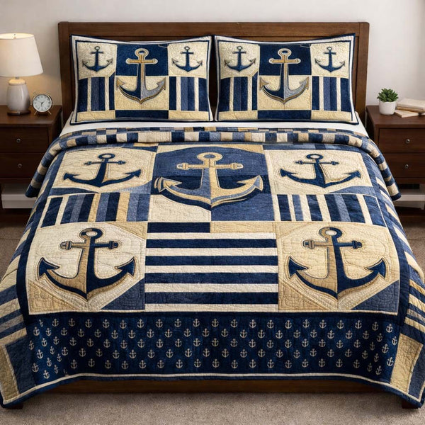 Ocean Anchor quilted 3-piece bedding set on a made bed in a light coastal bedroom