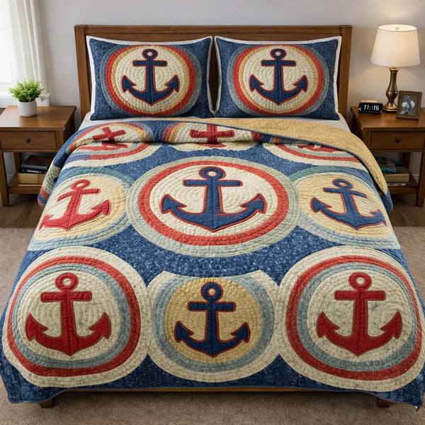 Ocean Anchor quilted 3-piece bedding set on a made bed in a light coastal bedroom