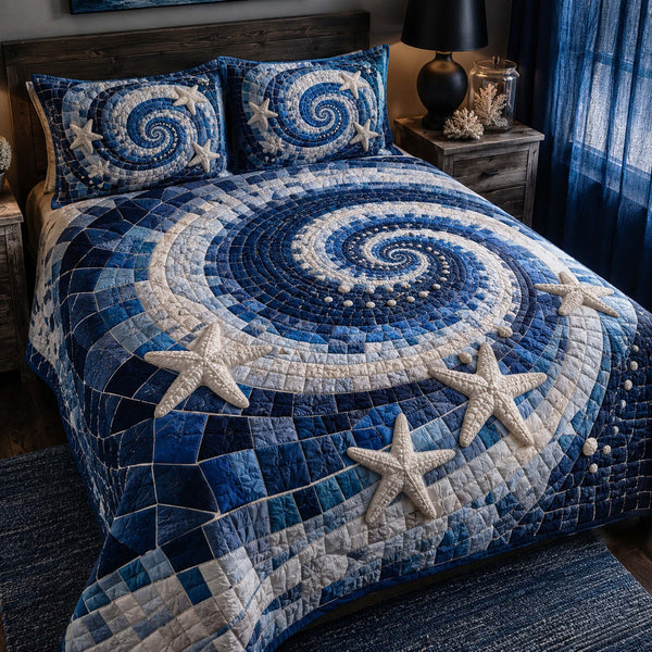 Ocean Bliss quilted 3-piece bedding set on a made bed in a light coastal bedroom