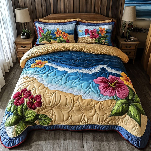 Ocean Bloom quilted 3-piece bedding set on a made bed in a light coastal bedroom