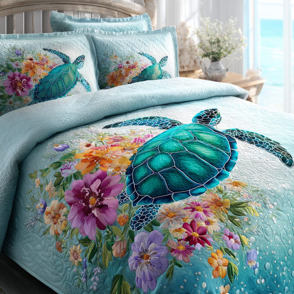 Ocean Bloom quilted 3-piece bedding set on a made bed in a light coastal bedroom
