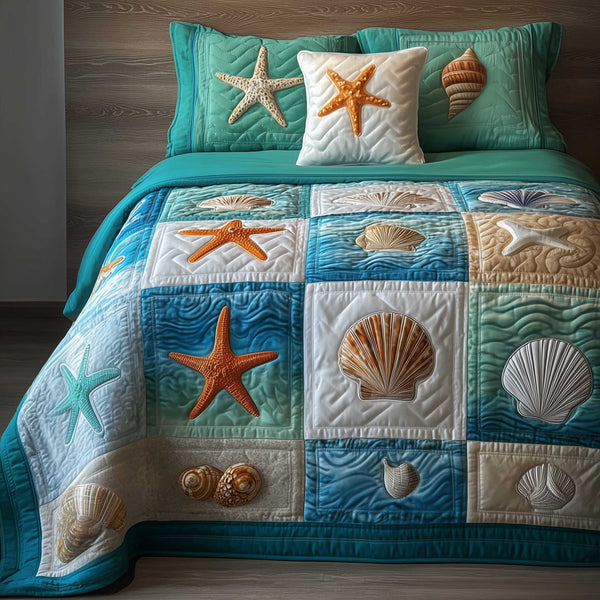 Ocean Breeze quilted 3-piece bedding set on a made bed in a light coastal bedroom