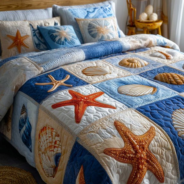 Ocean Breeze quilted 3-piece bedding set on a made bed in a light coastal bedroom