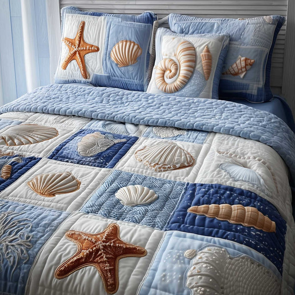 Ocean Breeze quilted 3-piece bedding set on a made bed in a light coastal bedroom