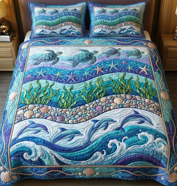 Ocean Breeze quilted 3-piece bedding set on a made bed in a light coastal bedroom