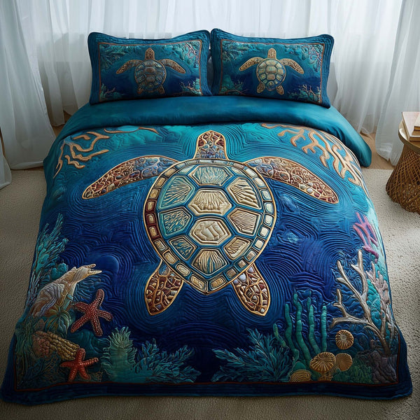 Ocean Breeze quilted 3-piece bedding set on a made bed in a light coastal bedroom