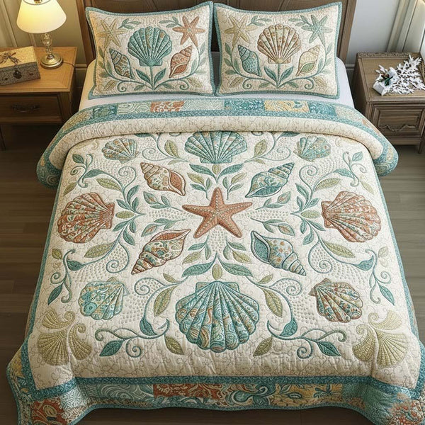 Ocean Breeze quilted 3-piece bedding set on a made bed in a light coastal bedroom