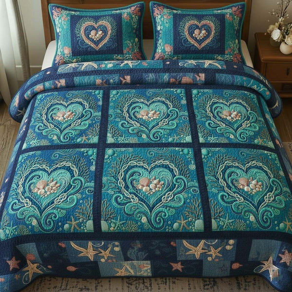 Ocean Breeze quilted 3-piece bedding set on a made bed in a light coastal bedroom