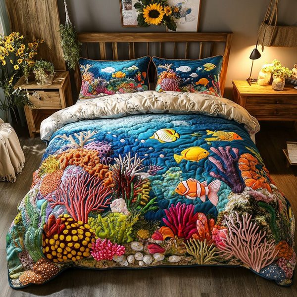 Ocean Breeze quilted 3-piece bedding set on a made bed in a light coastal bedroom