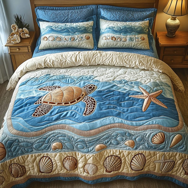 Ocean Breeze quilted 3-piece bedding set on a made bed in a light coastal bedroom