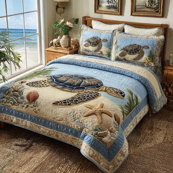 Ocean Breeze Turtle quilted 3-piece bedding set on a made bed in a light coastal bedroom