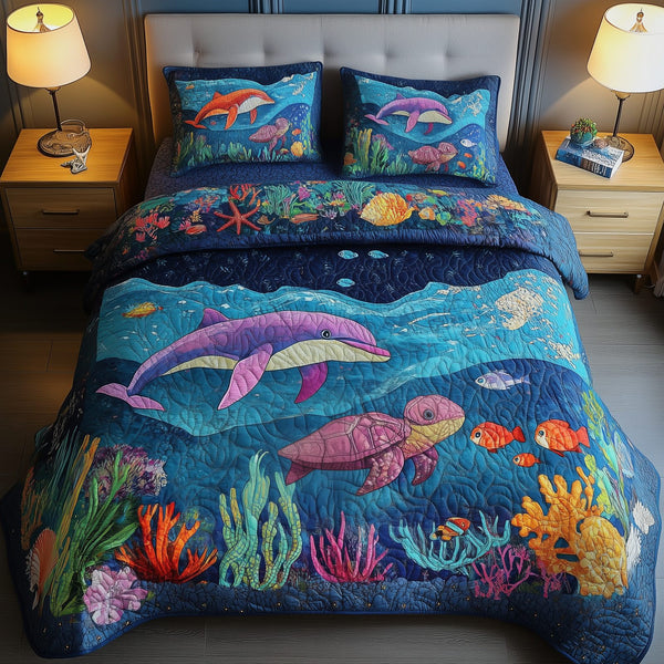 Ocean Dreamscape quilted 3-piece bedding set on a made bed in a light coastal bedroom