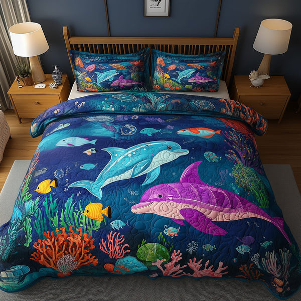 Ocean Dreamscape quilted 3-piece bedding set on a made bed in a light coastal bedroom