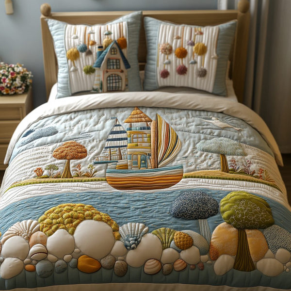 Ocean Dreamscape quilted 3-piece bedding set on a made bed in a light coastal bedroom