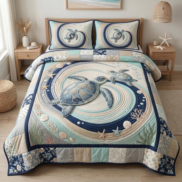 Ocean Embrace quilted 3-piece bedding set on a made bed in a light coastal bedroom