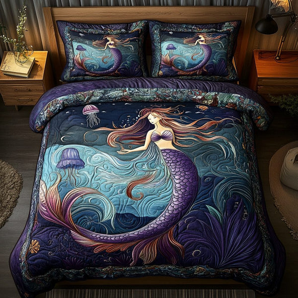 Ocean Enchantress quilted 3-piece bedding set on a made bed in a light coastal bedroom