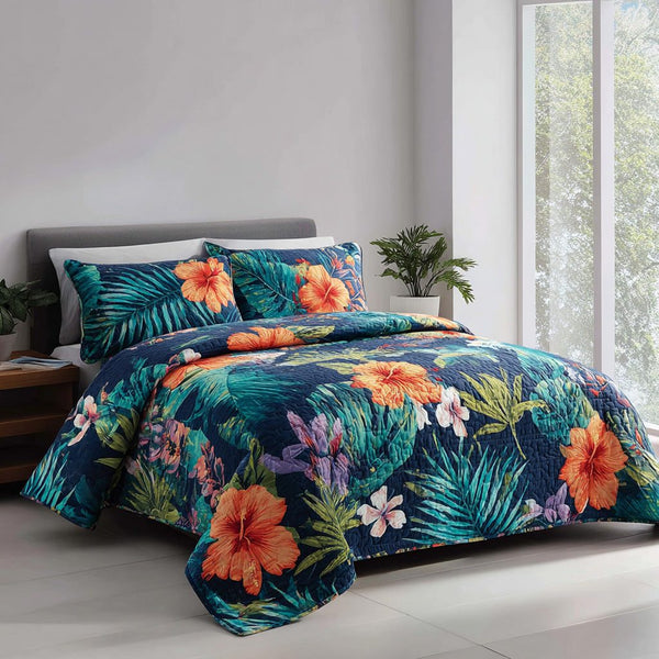 Ocean Flora quilted 3-piece bedding set on a made bed in a light coastal bedroom