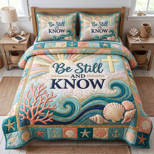 Ocean Grace quilted 3-piece bedding set on a made bed in a light coastal bedroom