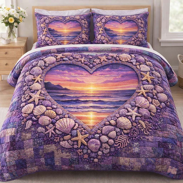 Ocean Heart quilted 3-piece bedding set on a made bed in a light coastal bedroom