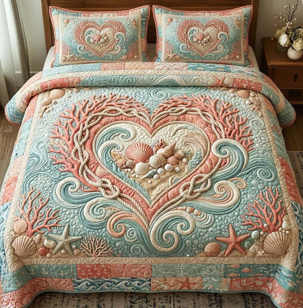 Ocean Love quilted 3-piece bedding set on a made bed in a light coastal bedroom