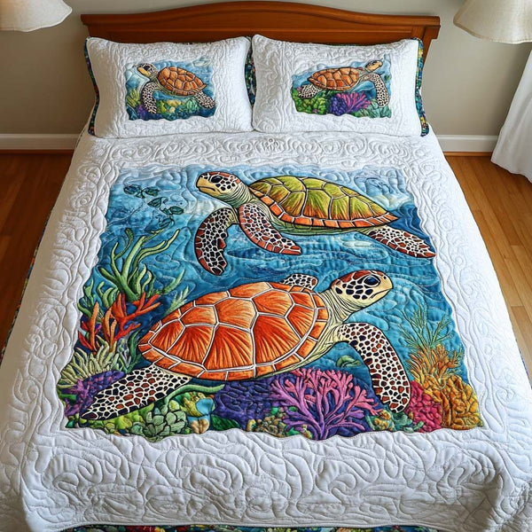 Ocean Mosaic quilted 3-piece bedding set on a made bed in a light coastal bedroom