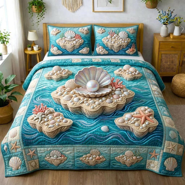 Ocean Pearls quilted 3-piece bedding set on a made bed in a light coastal bedroom