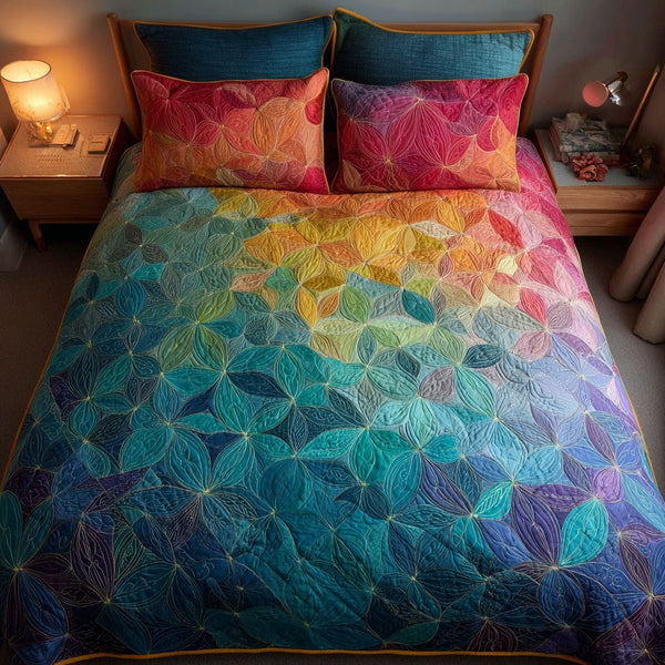 Ocean Petals quilted 3-piece bedding set on a made bed in a light coastal bedroom