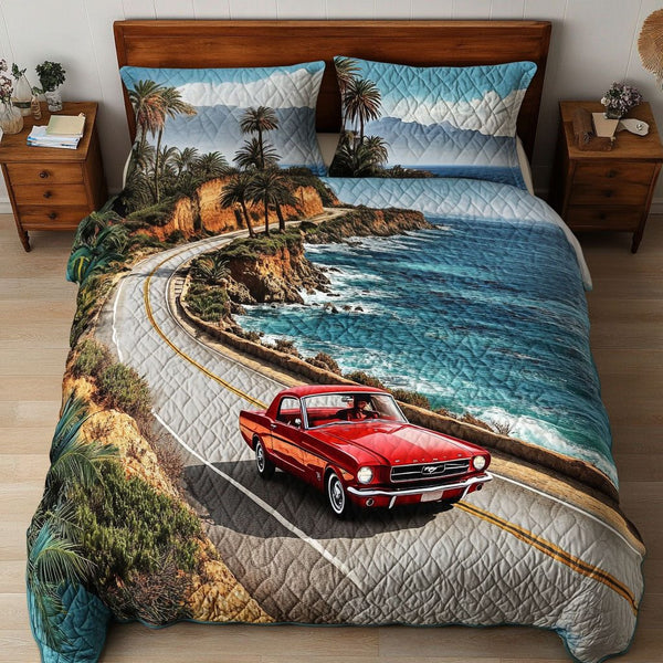 Ocean Roadtrip quilted 3-piece bedding set on a made bed in a light coastal bedroom