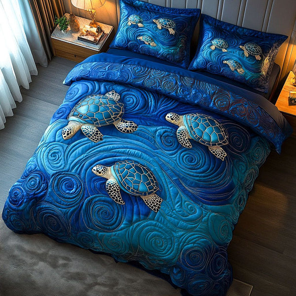 Ocean Shell Echo quilted 3-piece bedding set on a made bed in a light coastal bedroom