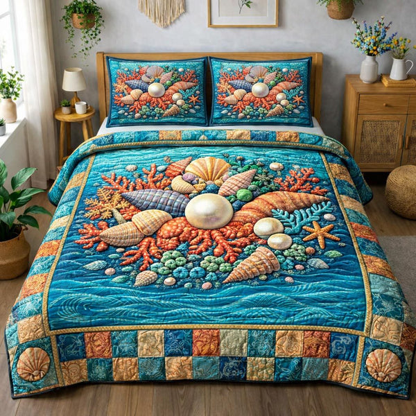 Ocean Shells quilted 3-piece bedding set on a made bed in a light coastal bedroom