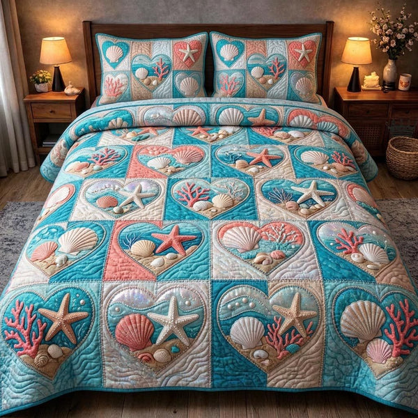 Ocean Shells quilted 3-piece bedding set on a made bed in a light coastal bedroom
