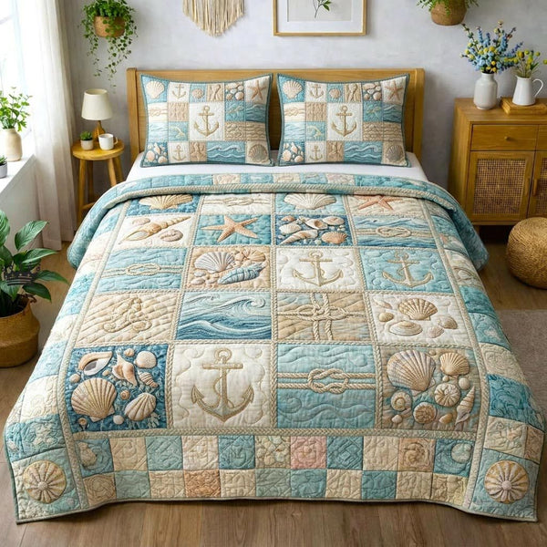 Ocean Shells quilted 3-piece bedding set on a made bed in a light coastal bedroom