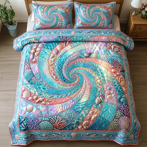 Ocean Shells quilted 3-piece bedding set on a made bed in a light coastal bedroom