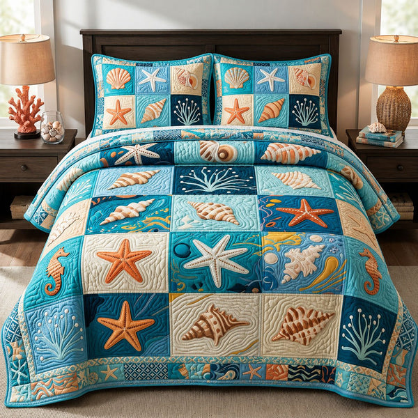 Ocean Shells quilted 3-piece bedding set on a made bed in a light coastal bedroom