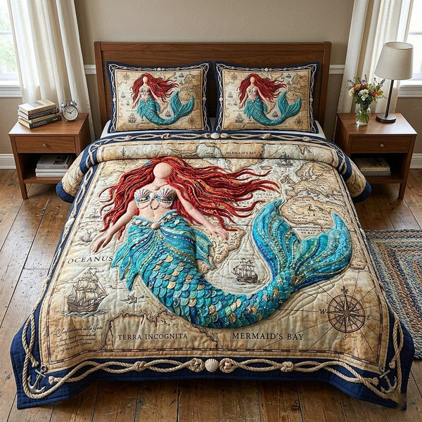 Ocean Siren quilted 3-piece bedding set on a made bed in a light coastal bedroom