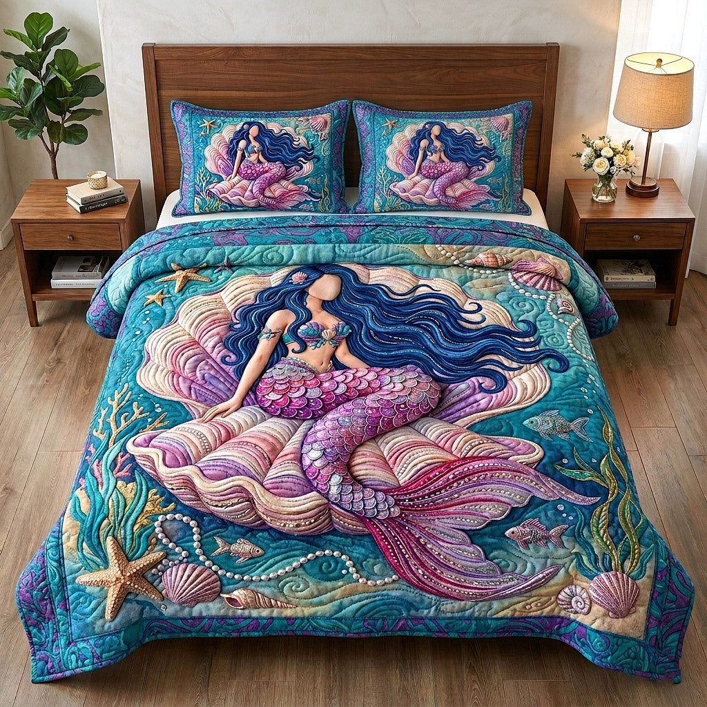 Ocean Siren quilted 3-piece bedding set on a made bed in a light coastal bedroom