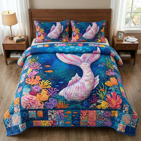 Ocean Siren quilted 3-piece bedding set on a made bed in a light coastal bedroom