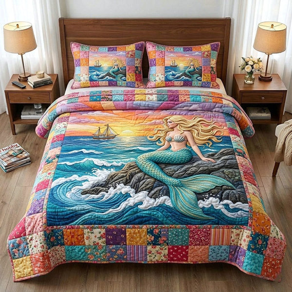 Ocean Siren quilted 3-piece bedding set on a made bed in a light coastal bedroom