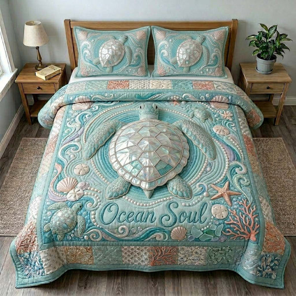 Ocean Soul Turtle quilted 3-piece bedding set on a made bed in a light coastal bedroom