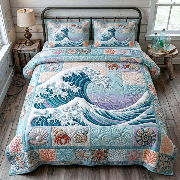 Ocean Tide quilted 3-piece bedding set on a made bed in a light coastal bedroom