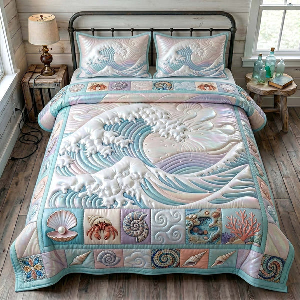 Ocean Tide quilted 3-piece bedding set on a made bed in a light coastal bedroom